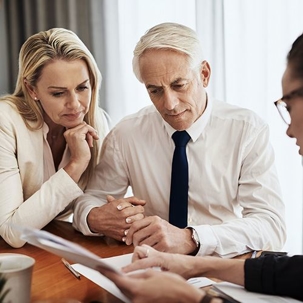 Man and woman looking at a document